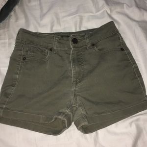Sage green high waisted shorts.